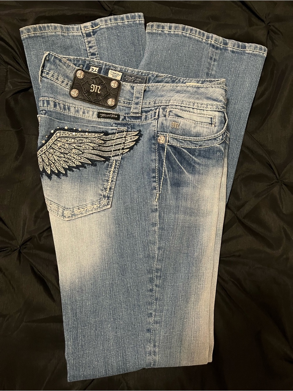 Miss Me Light Blue Faded Bootcut Jeans with Wing Pocket Detail.  34 inseam